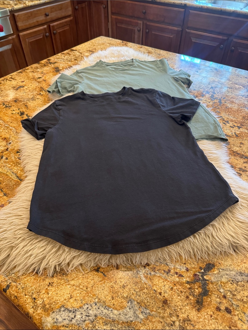 Bundle Lululemon Women’s Tees. One black one green. Size 4 no tags.